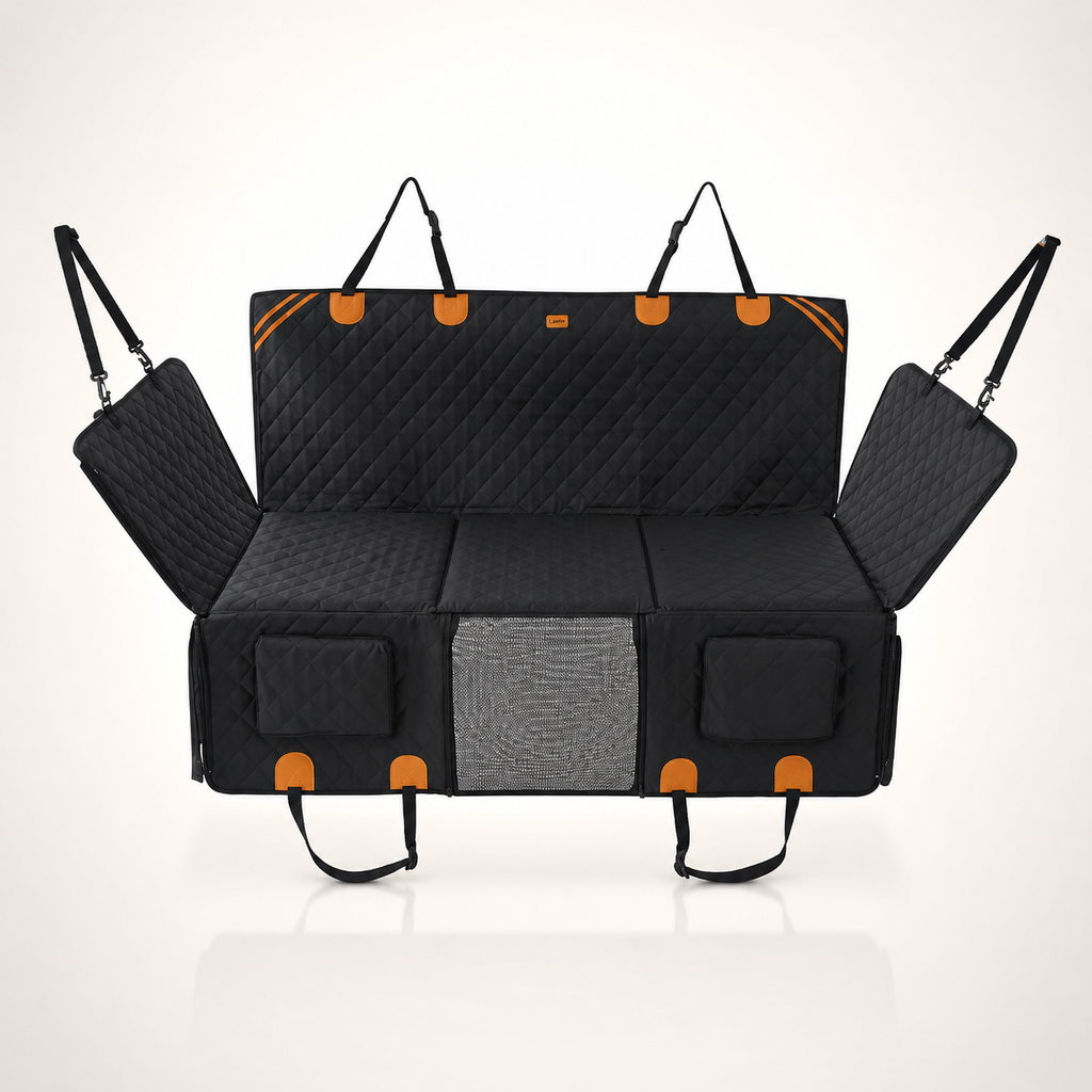 RoadTuck SeatSpan dog backseat extender in black with orange trim, hard bottom platform extended across the rear footwell