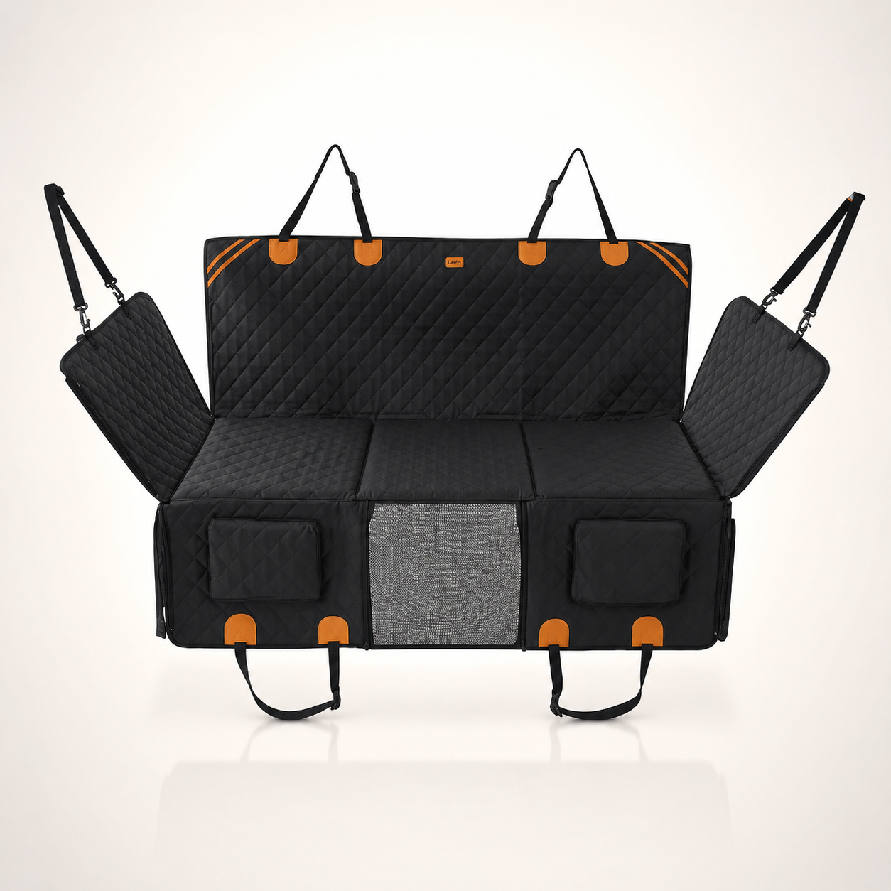 RoadTuck SeatSpan dog backseat extender in black with orange trim, hard bottom platform extended across the rear footwell